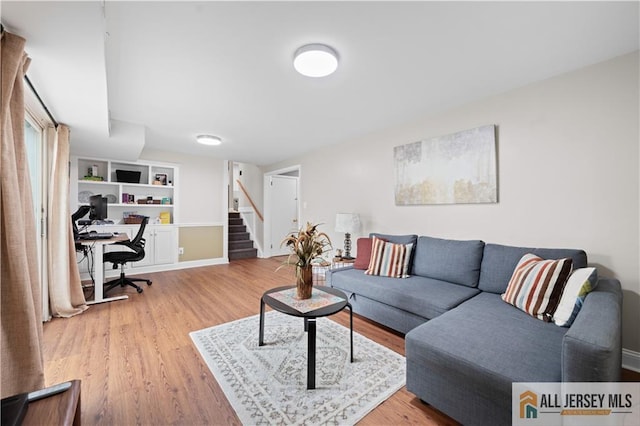 34 Connor Ave, Metuchen, NJ 08840 - living room featuring a desk, stairway, and wood finished floors