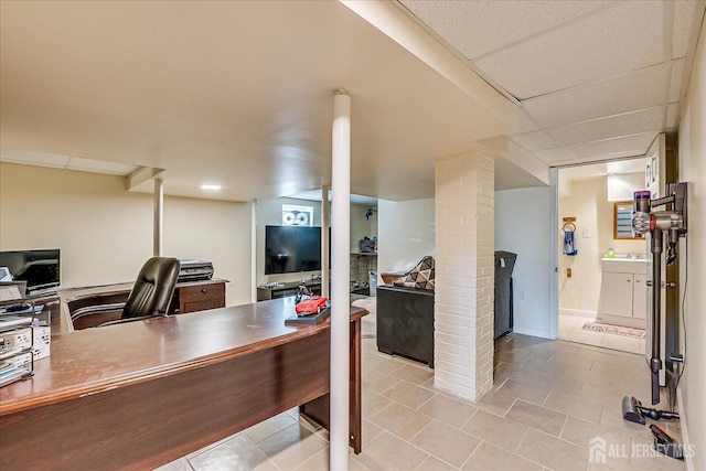 tiled office with a paneled ceiling