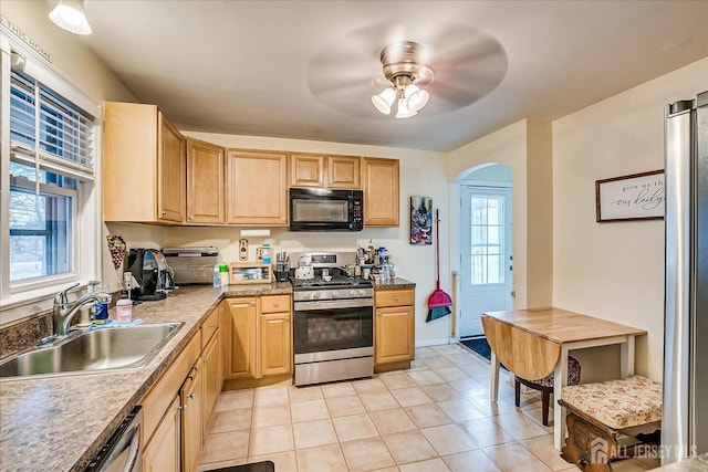 kitchen with sink, light brown cabinets, ceiling fan, and appliances with stainless steel finishes