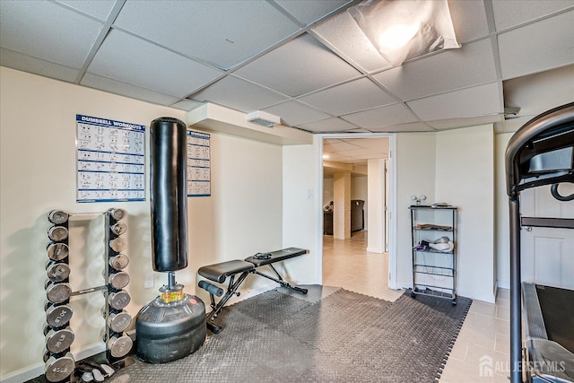 workout area with a paneled ceiling