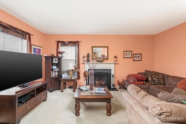 living room with light carpet and a fireplace with flush hearth