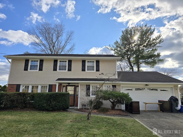 view of front property featuring a garage and a front lawn