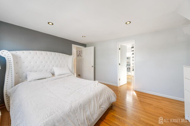 bedroom featuring wood-type flooring