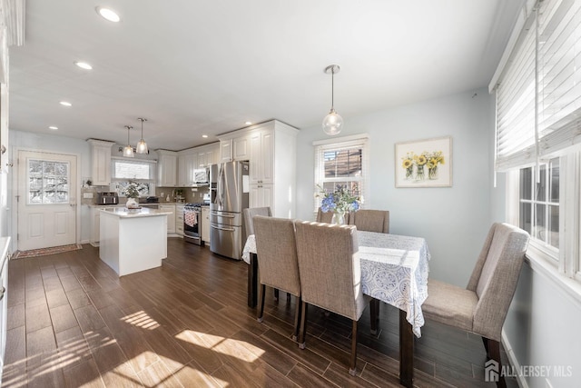 dining room with dark wood-type flooring