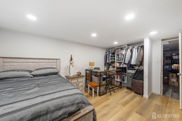 bedroom with light hardwood / wood-style floors