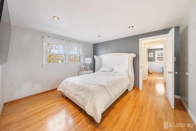 bedroom with light hardwood / wood-style flooring