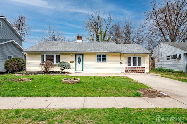 ranch-style house featuring a front lawn and a chimney