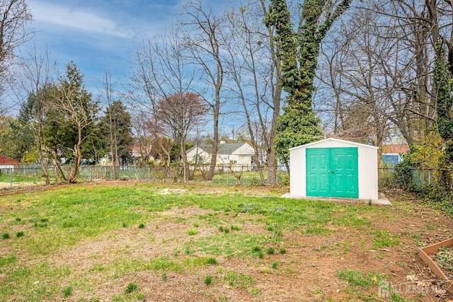 view of yard with a storage shed and an outdoor structure