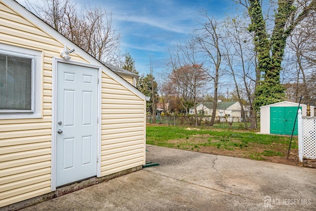 view of shed with fence