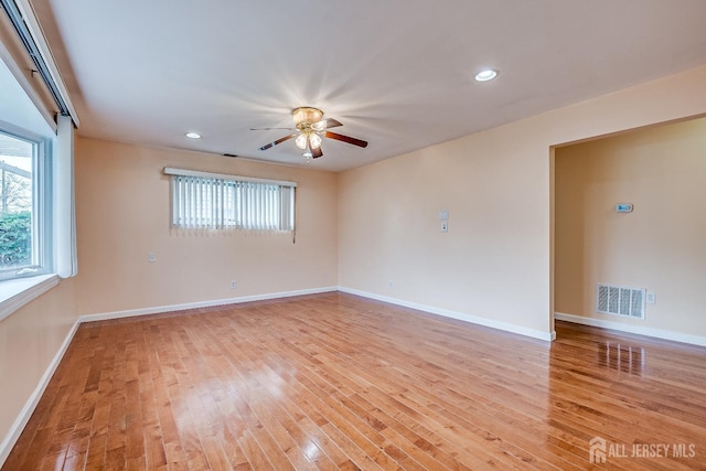 spare room with ceiling fan, light wood-style floors, baseboards, and recessed lighting