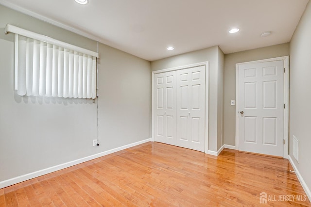 174 Winthrop Rd, Edison, NJ 08817 - unfurnished bedroom featuring light wood-style floors, a closet, and recessed lighting