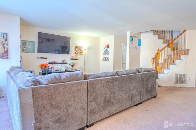 living room with visible vents, stairway, and carpet flooring