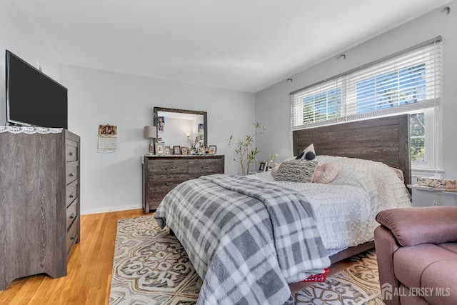 bedroom with light hardwood / wood-style flooring