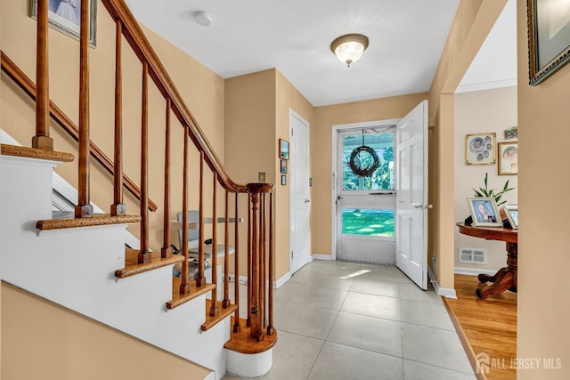 entrance foyer with light tile patterned floors