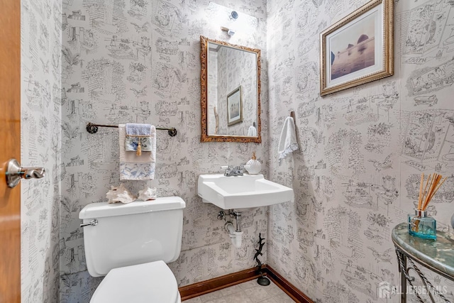 bathroom featuring sink and toilet