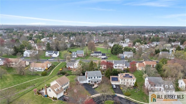 aerial view of property's location with nearby suburban area