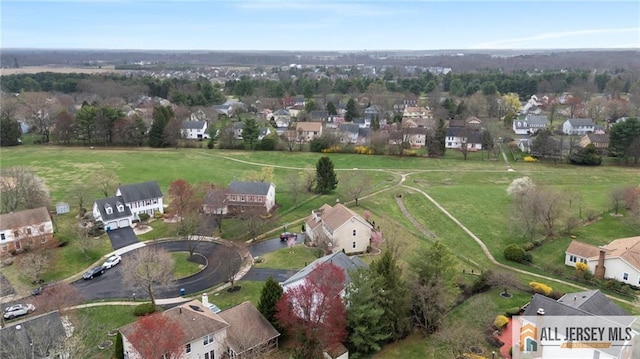 aerial view of property's location featuring nearby suburban area