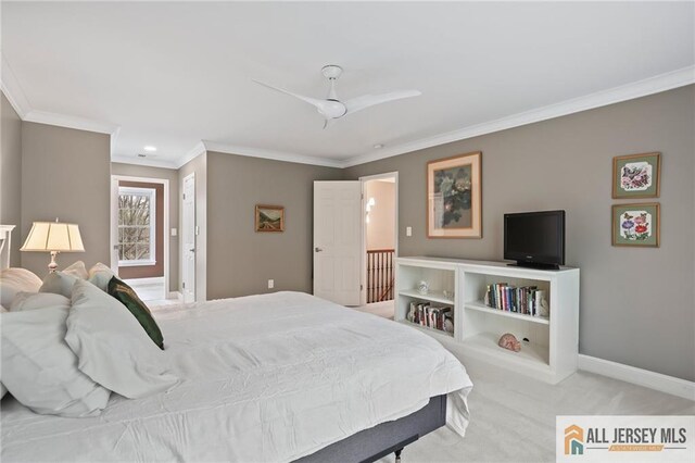 bedroom with ornamental molding, light colored carpet, baseboards, and a ceiling fan
