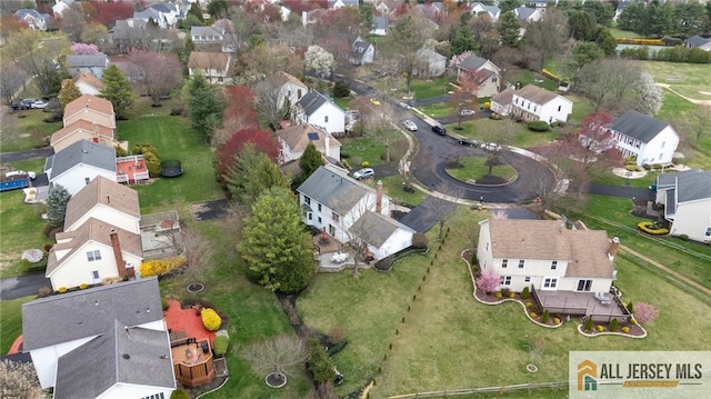 aerial view of property's location with nearby suburban area