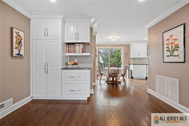 kitchen with open shelves, crown molding, baseboards, and white cabinetry