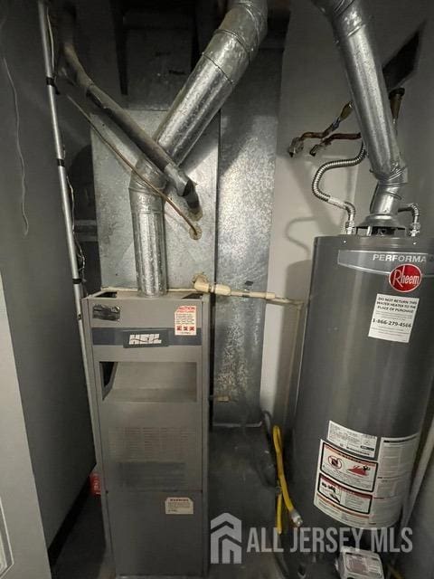 utility room with gas water heater