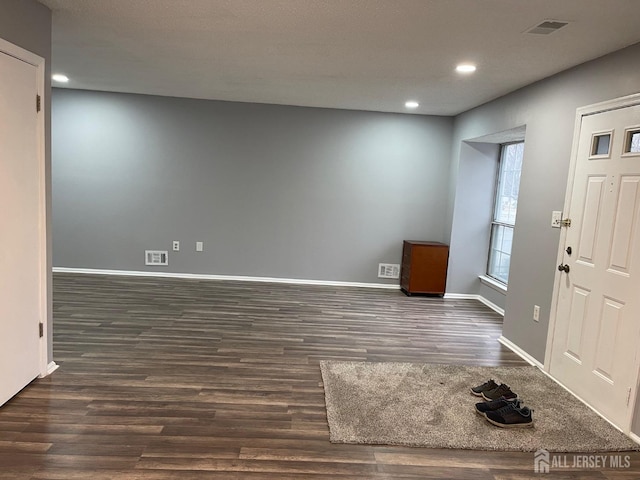 entrance foyer with dark wood-type flooring