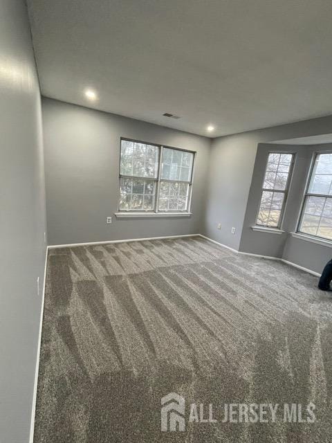 empty room featuring carpet flooring