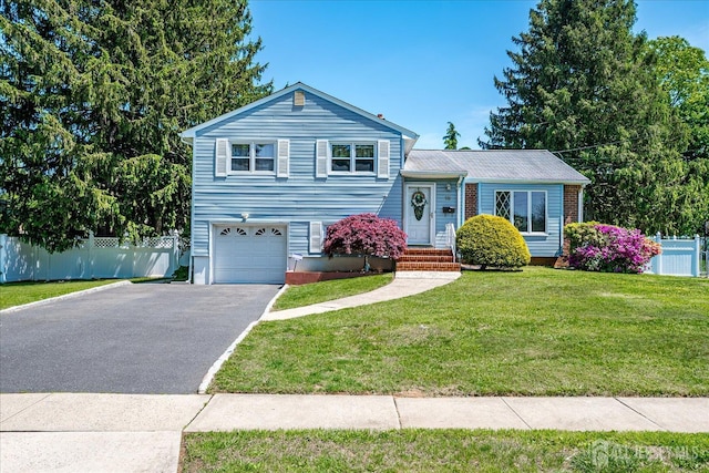 16 Landsdowne Rd, East Brunswick, NJ 08816 - tri-level home featuring asphalt driveway and an attached garage