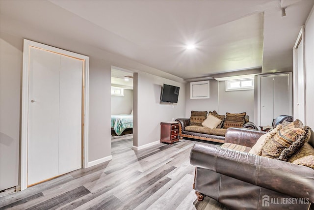 living room with light wood-style floors and baseboards