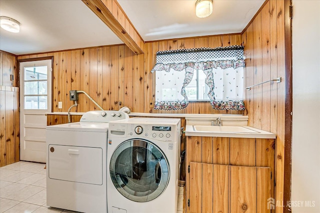 16 Landsdowne Rd, East Brunswick, NJ 08816 - laundry room featuring washing machine and clothes dryer, wood walls, healthy amount of natural light, and light tile patterned floors