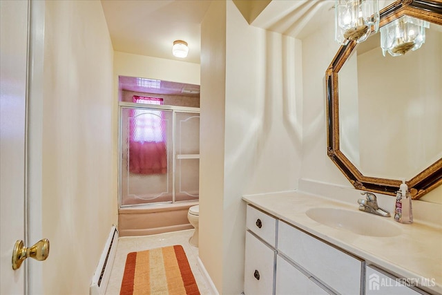 bathroom featuring baseboard heating, toilet, vanity, enclosed tub / shower combo, and tile patterned flooring