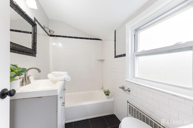 334 Hillcrest Ave, Plainfield, NJ 07062 - full bathroom with tile walls, tile patterned floors, vanity, toilet, and radiator