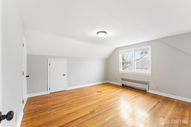 334 Hillcrest Ave, Plainfield, NJ 07062 - additional living space with radiator, light wood finished floors, vaulted ceiling, and baseboards