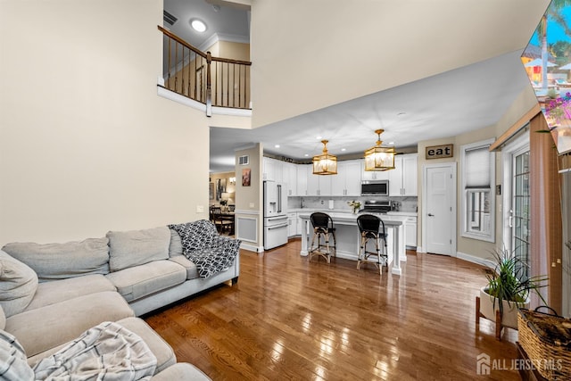 20 Mccormick Ave, Old Bridge, NJ 08857 - living room featuring hardwood / wood-style floors and a high ceiling