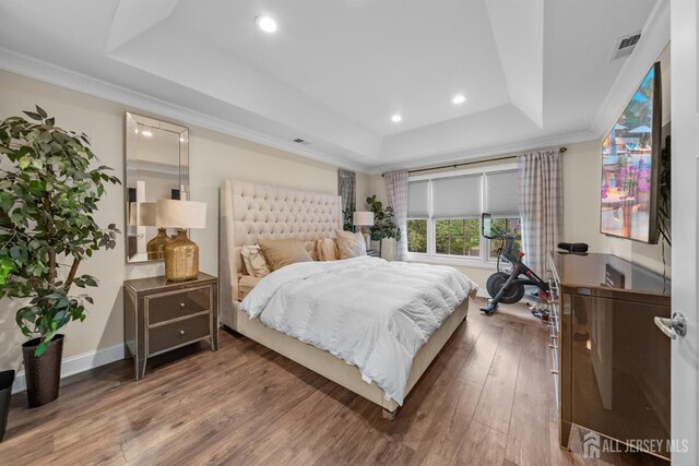20 Mccormick Ave, Old Bridge, NJ 08857 - bedroom with a tray ceiling, wood-type flooring, recessed lighting, ornamental molding, and baseboards
