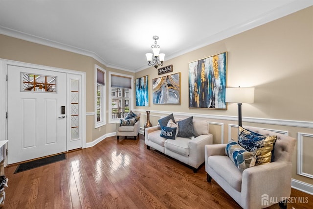 20 Mccormick Ave, Old Bridge, NJ 08857 - entryway featuring a chandelier, wood-type flooring, crown molding, and wainscoting