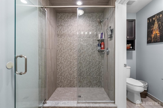 20 Mccormick Ave, Old Bridge, NJ 08857 - full bathroom featuring toilet, a stall shower, and wood finished floors