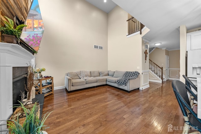20 Mccormick Ave, Old Bridge, NJ 08857 - living room with stairs, light wood-style floors, a premium fireplace, and baseboards