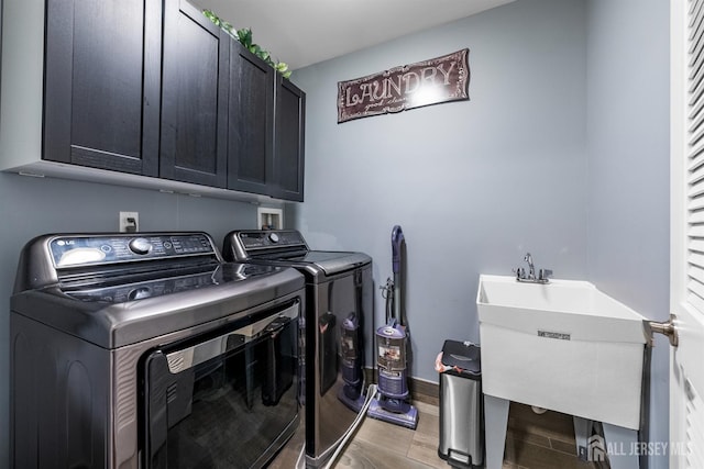 20 Mccormick Ave, Old Bridge, NJ 08857 - laundry area with cabinet space, washing machine and dryer, light wood-style flooring, and baseboards