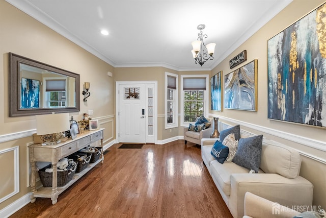 20 Mccormick Ave, Old Bridge, NJ 08857 - foyer entrance with a chandelier, wood finished floors, ornamental molding, recessed lighting, and wainscoting