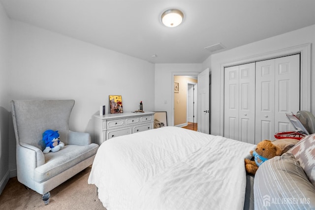 20 Mccormick Ave, Old Bridge, NJ 08857 - bedroom with baseboards, a closet, and light carpet