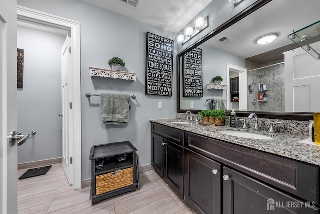20 Mccormick Ave, Old Bridge, NJ 08857 - full bath with double vanity, tiled shower, and baseboards