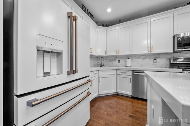 20 Mccormick Ave, Old Bridge, NJ 08857 - kitchen featuring appliances with stainless steel finishes, a sink, white cabinets, backsplash, and recessed lighting