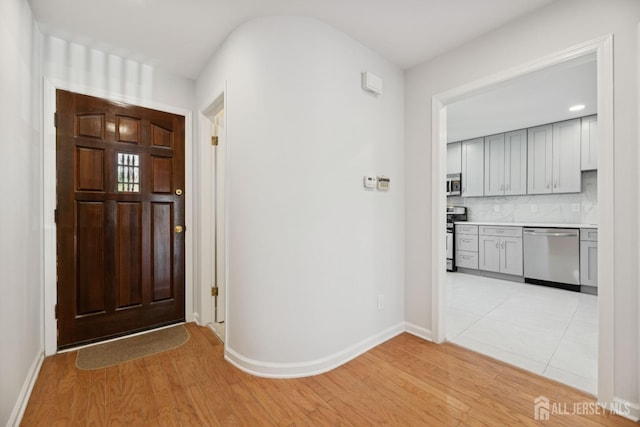 210 N 2nd Ave, Highland Park, NJ 08904 - foyer entrance with light wood-style flooring and baseboards