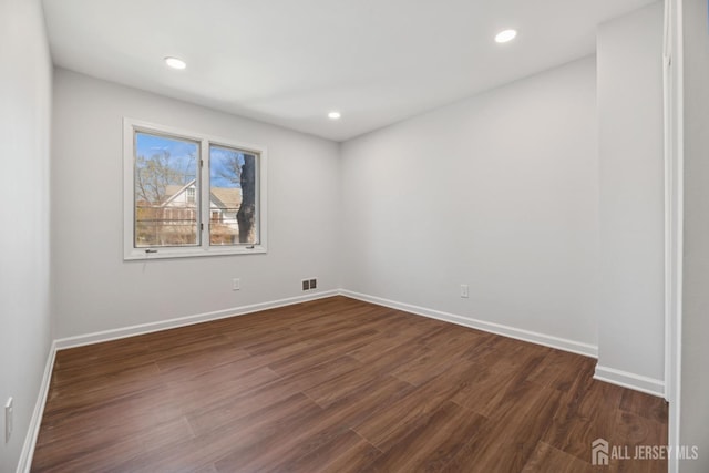 210 N 2nd Ave, Highland Park, NJ 08904 - spare room with dark wood-style floors, baseboards, and recessed lighting