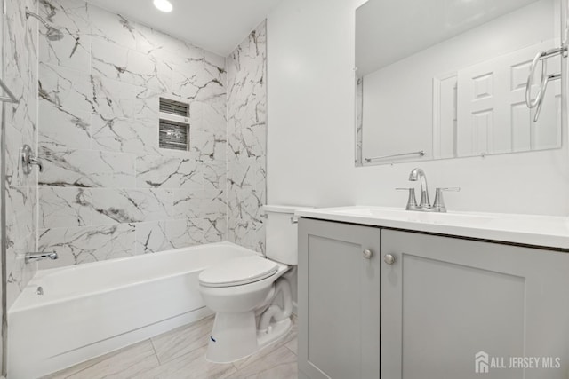 210 N 2nd Ave, Highland Park, NJ 08904 - full bathroom featuring vanity, toilet, washtub / shower combination, recessed lighting, and marble look tiles