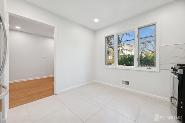 210 N 2nd Ave, Highland Park, NJ 08904 - spare room with recessed lighting, baseboards, and light tile patterned flooring