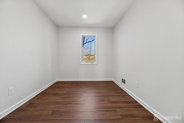 210 N 2nd Ave, Highland Park, NJ 08904 - unfurnished room with baseboards, dark wood-type flooring, and recessed lighting