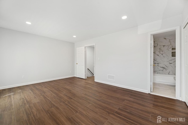 210 N 2nd Ave, Highland Park, NJ 08904 - unfurnished bedroom featuring dark wood-style flooring, recessed lighting, baseboards, and ensuite bathroom