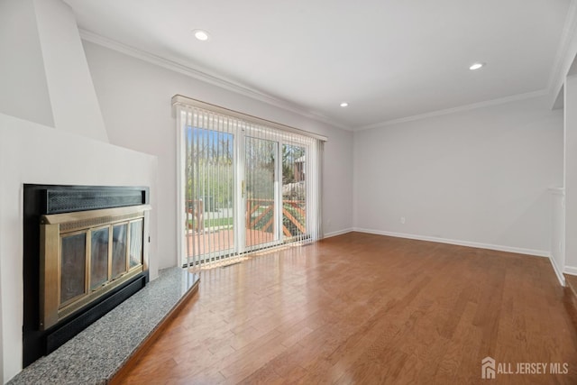 210 N 2nd Ave, Highland Park, NJ 08904 - unfurnished living room featuring a glass covered fireplace, wood finished floors, crown molding, baseboards, and recessed lighting